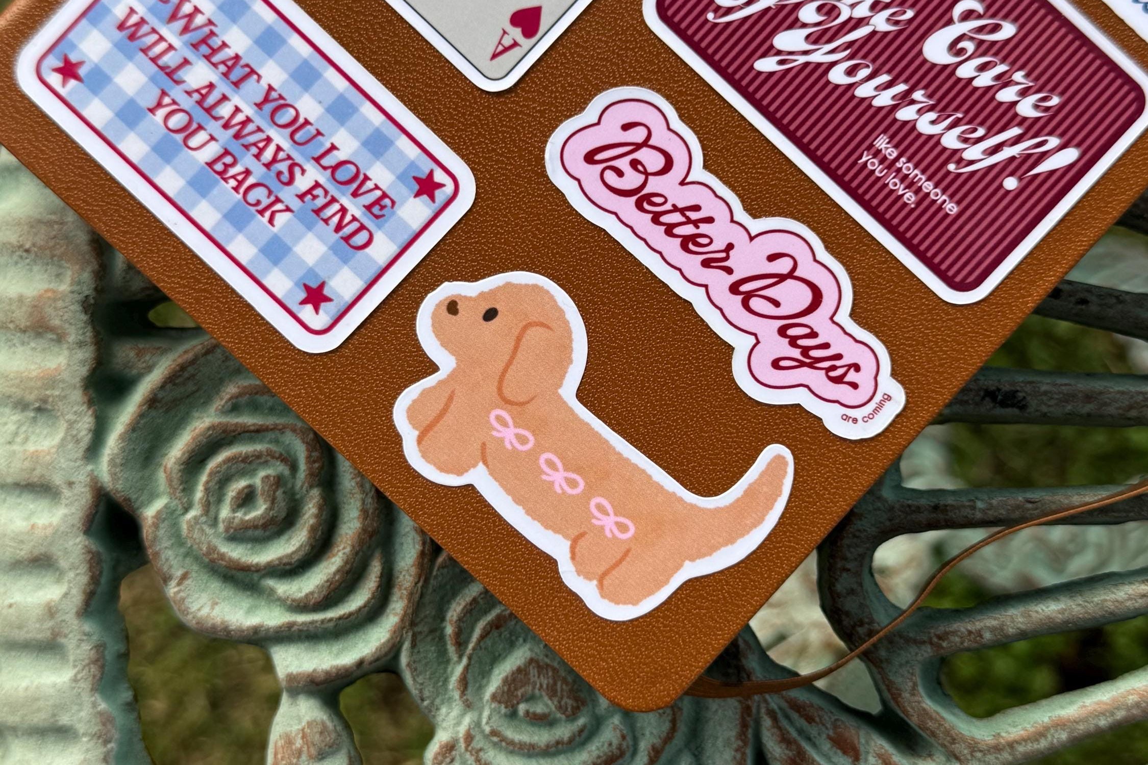 Collection of vintage-style cards with text and graphics on a decorative surface.